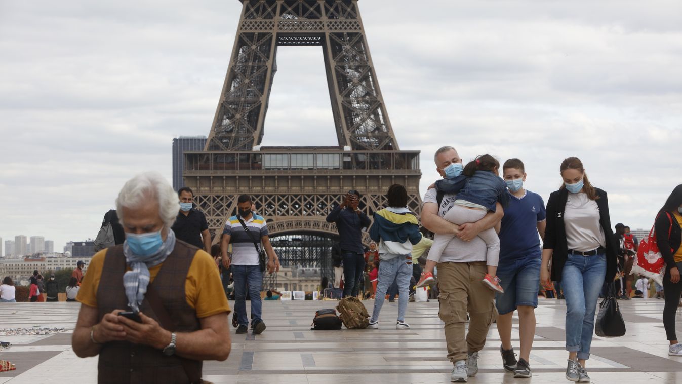 Coronavirus In Paris Coronavirus In Paris TOURIST TOURISM EIFFEL TOWER people ECONOMY france MEDICINE AND HEALTH PROTECTIVE MASK Mehdi Taamallah NurPhoto Paris Tourists person clothing SKY footwear MAN outdoor ground JEANS BUILDING Medium Group Of People 