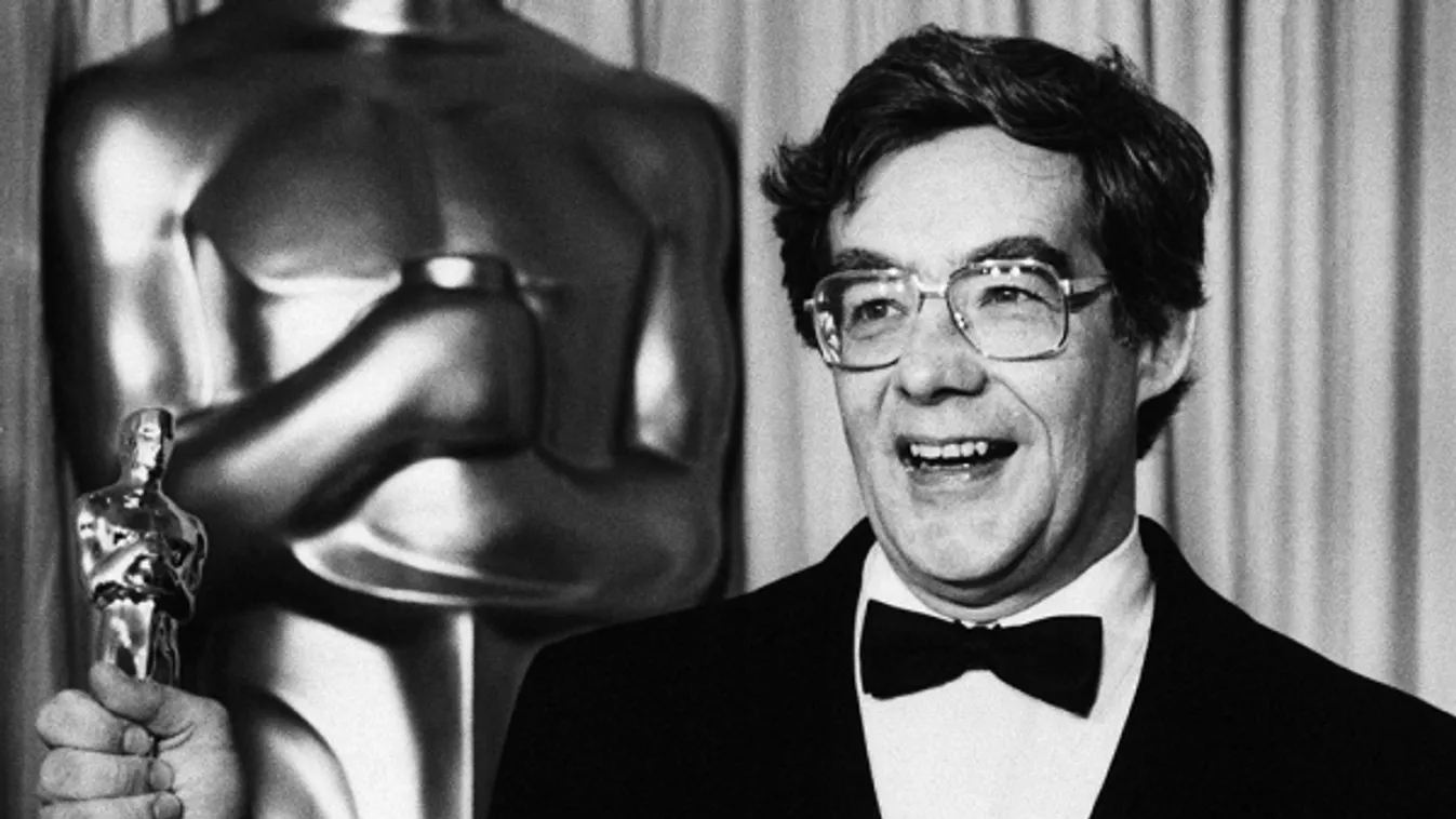 awared,Away,Close-Up,Fame,Holding,Looking,Posing,Smiling,Standin Kurt Luedtke holds Oscar he won for screenplay based on material from another medium for film "Out of Africa", at Academy Awards in Los Angeles on Monday night, March 24, 1986. (AP Photo/Len