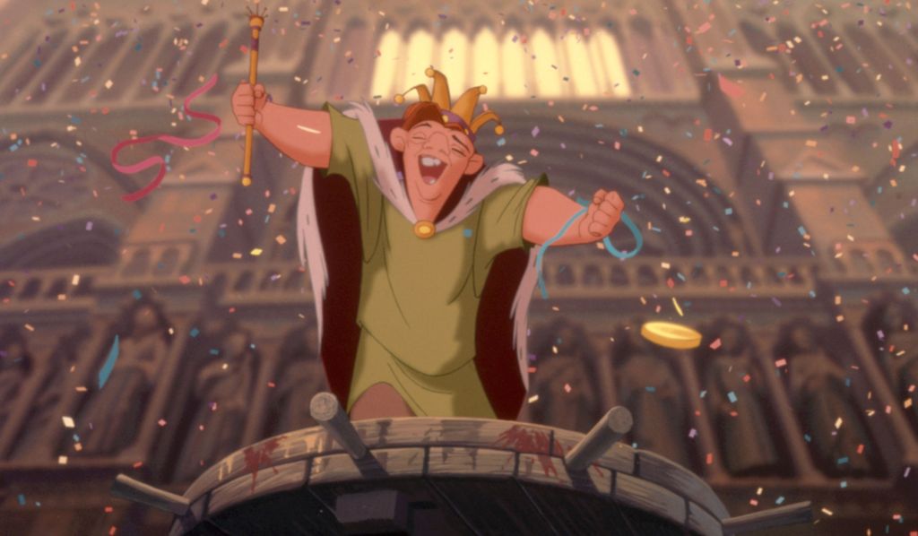 HUNCHBACK OF NOTRE DAME,  Quasimodo (voice: Tom Hulce), 1996. (c) Buena Vista Pictures/ Courtesy: Ev 1990s movies 1996 movies Animated Animated characters Animation Confetti Crown Festivity Glee Happiness Hulce,tom Making a fist Movies Notre dame Quasimod