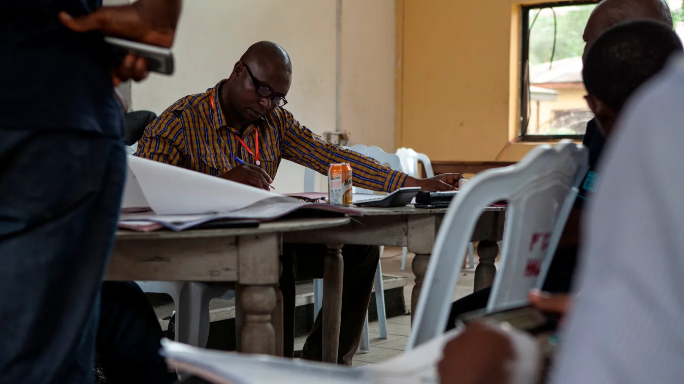 Horizontal A local representative of the Nigeria Independent National Electoral Commision (INEC) collates figures from the general election in Port Harcourt, capital of Nigeria's southern oil-rich Rivers State, on March 29, 2015. Nigeria's closely fought 