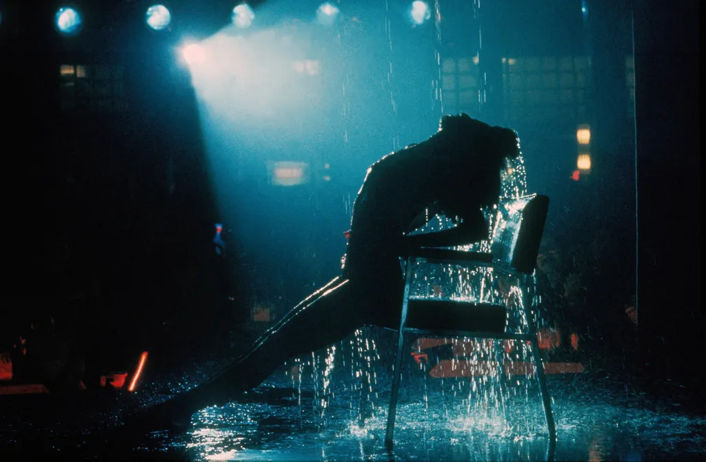 Flashdance Cinema movie film still movie still publicity still production still dancer show performance arched back torrid 1980s eighties Horizontal FILM WOMAN ACTRESS SPOTLIGHT CHAIR WATER 