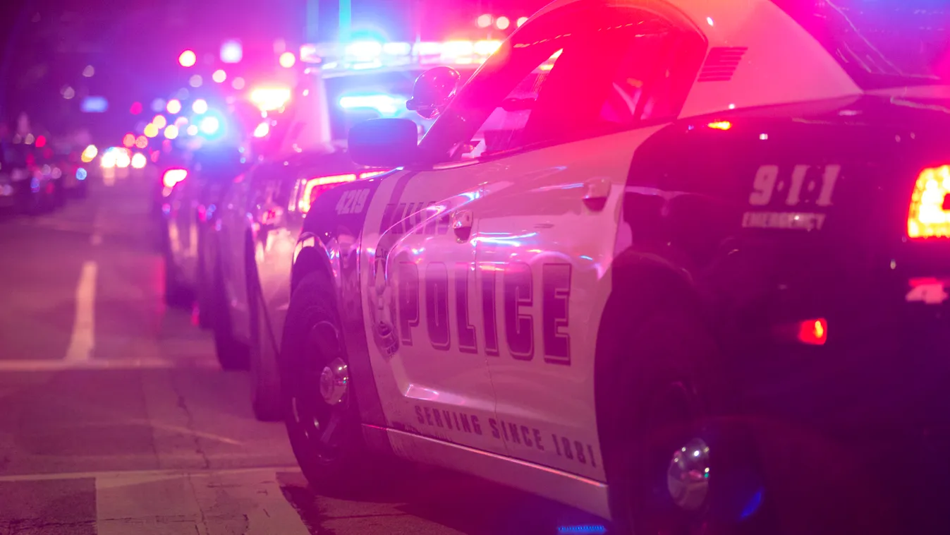 Horizontal Police cars sit on Main Street in Dallas following the sniper shooting during a protest on July 7, 2016. 
A fourth police officer was killed and two suspected snipers were in custody after a protest late Thursday against police brutality in Dal
