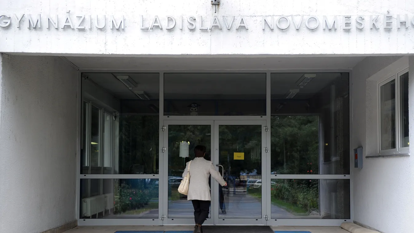 Horizontal An employee enters on September 13, 2012 the Ladislava Novomestkeho grammar school in Bratislava during a nationwide, one-day employee and teacher's strike in Slovakia. 
AFP PHOTO  /SAMUEL KUBANI / AFP / SAMUEL KUBANI 