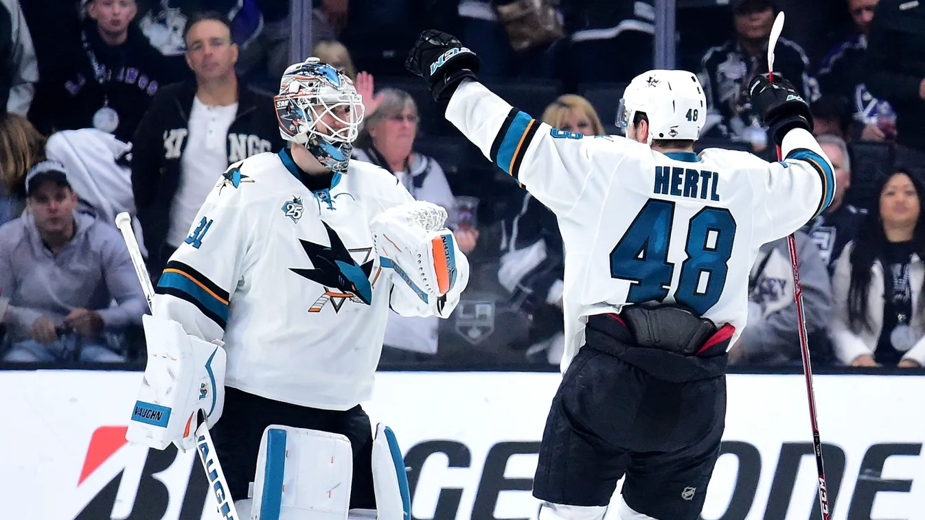 Martin Jones #31 of the San Jose Sharks and Tomas Hertl #48 celebrate a 5-3 win over the Los Angeles Kings 