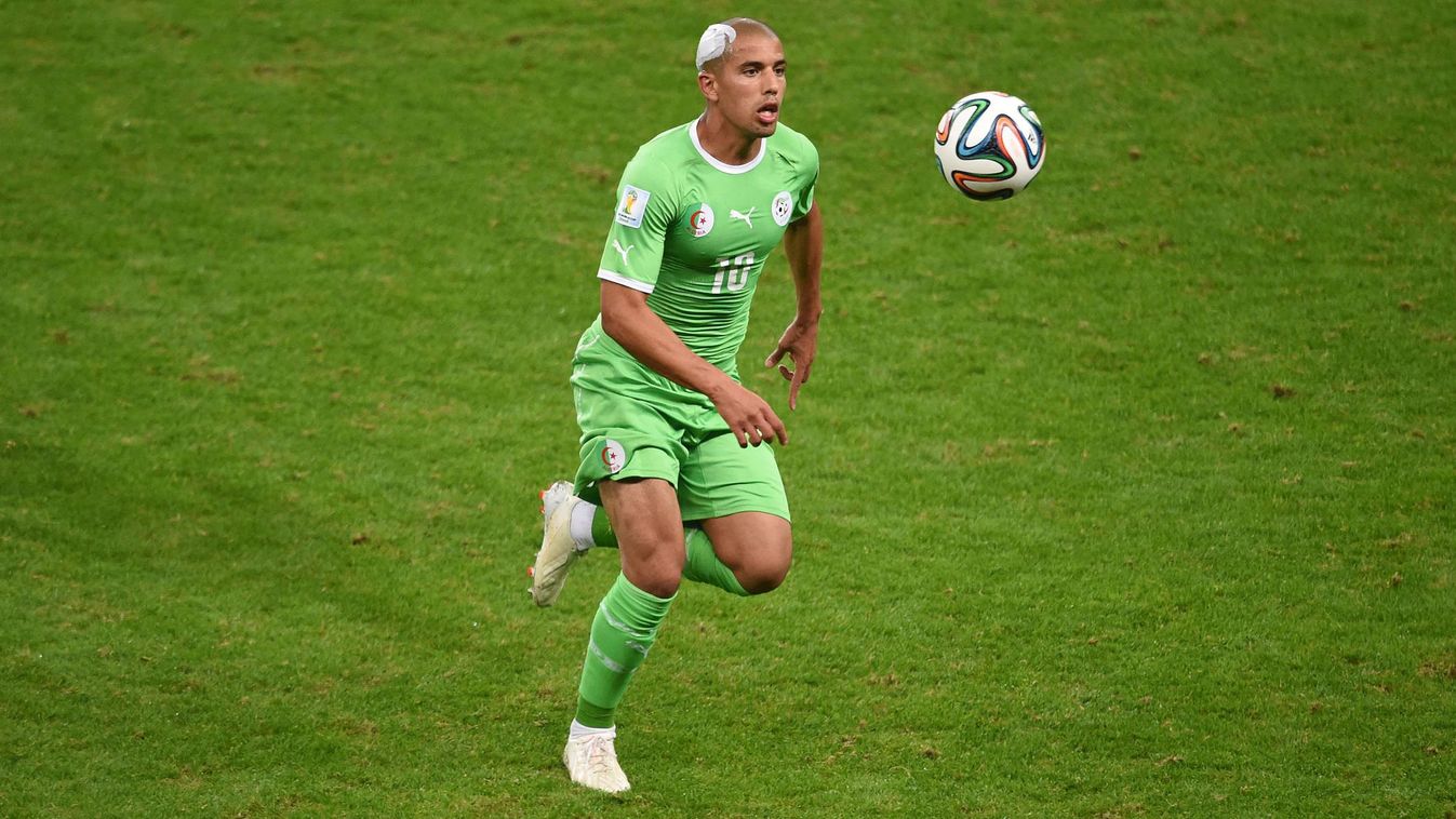 491717111 Algeria's forward Sofiane Feghouli plays the ball during the Round of 16 football match between Germany and Algeria at Beira-Rio Stadium in Porto Alegre during the 2014 FIFA World Cup on June 30, 2014.  AFP PHOTO / CHRISTOPHE SIMON 