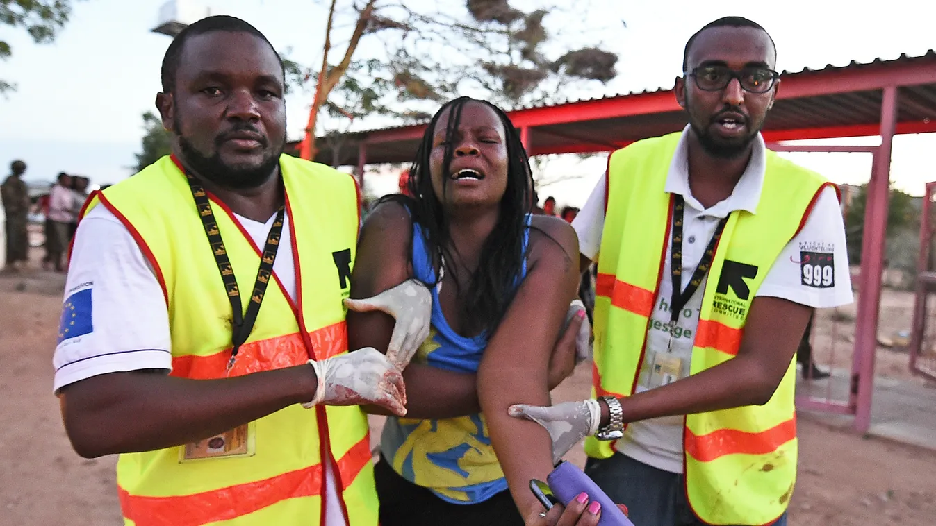 Paramedics help a student who was injured during an attack by Somalia's Al-Qaeda-linked Shebab gunmen on the Moi University campus in Garissa on April 2, 2015. At least 70 students were massacred when Somalia's Shebab Islamist group attacked a Kenyan univ