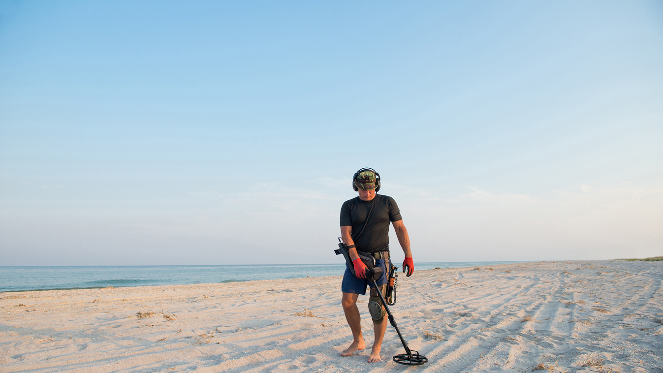 Man,With,A,Metal,Detector,On,A,Sea,Sandy,Beach dig,ring,headphones,shovel,find,lost,military,hunter,discover,hu Man with a metal detector on a sea sandy beach
 fémdetektor detektor 