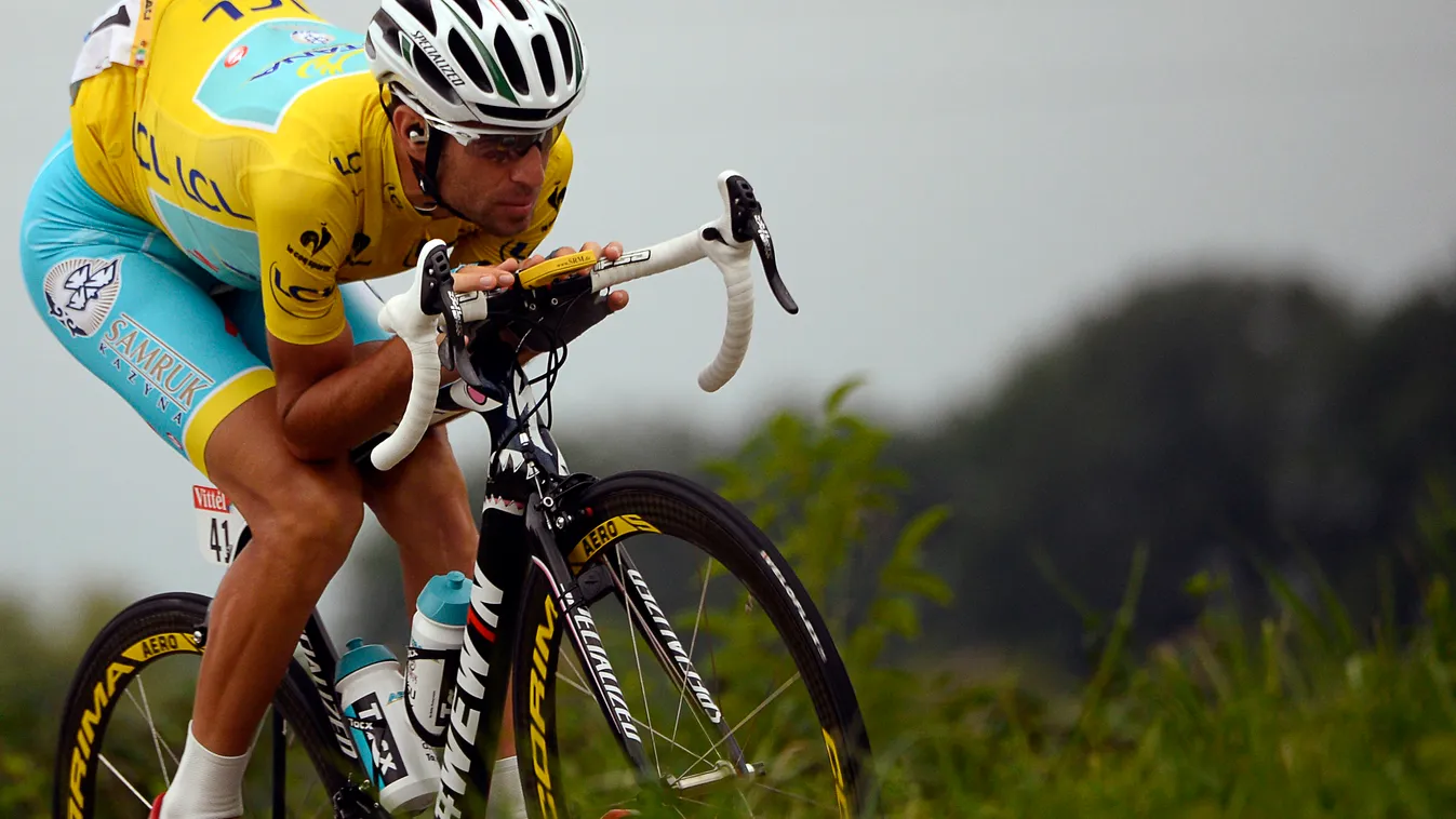 496135819 Italy's Vincenzo Nibali wearing the overall leader's yellow jersey rides in the pack during the 208.5 km nineteenth stage of the 101st edition of the Tour de France cycling race on July 25, 2014 between Maubourguet Pays du Val d'Adour and Berger