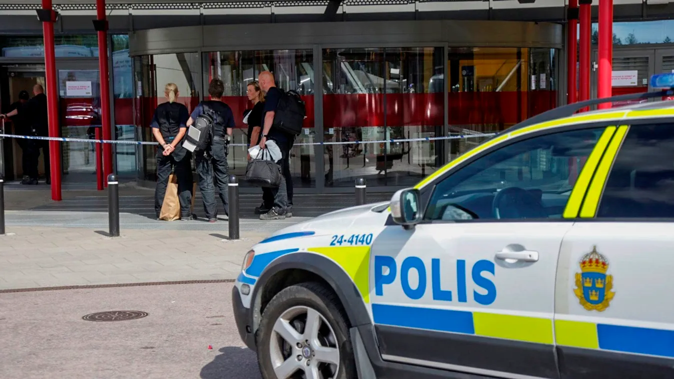Mobile phone picture taken on August 10, 2015, shows a police car in front of an Ikea market in the central Swedish town of Vasteras. Two people were stabbed to death at the Ikea store in Vasteras and a third person was wounded, police said on August 10, 