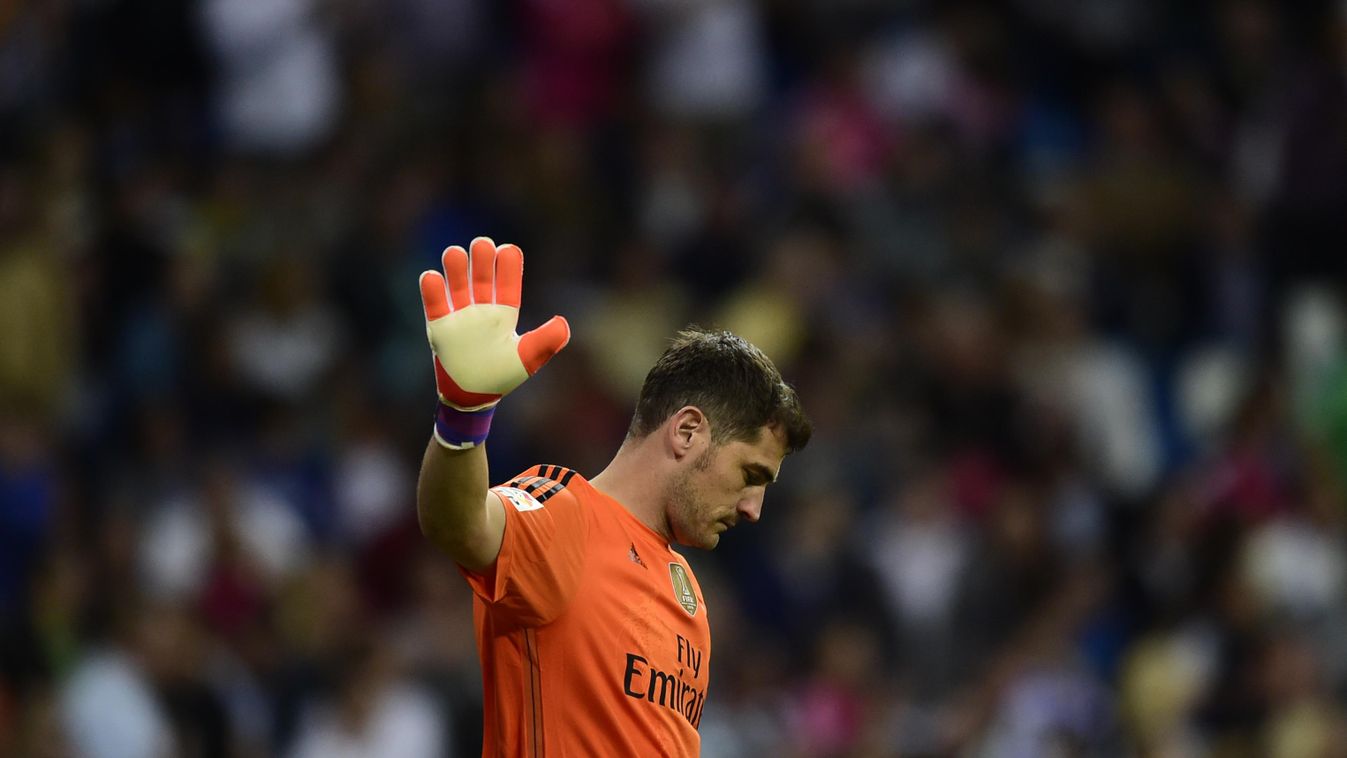 Real Madrid's goalkeeper Iker Casillas gestures during the Spanish league football match Real Madrid CF vs Getafe CF at the Santiago Bernabeu stadium in Madrid on May 23, 2015.   AFP PHOTO / PIERRE-PHILIPPE MARCOU 