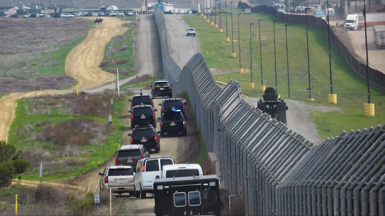 TOPSHOTS Horizontal PRESIDENT BORDER WALL IMMIGRATION CAR (FILES) In this file photo taken on March 13, 2018 the motorcade carrying US President Donald Trump drives past a US-Mexico border fence as Trump heads for an inspection of  border wall prototypes 