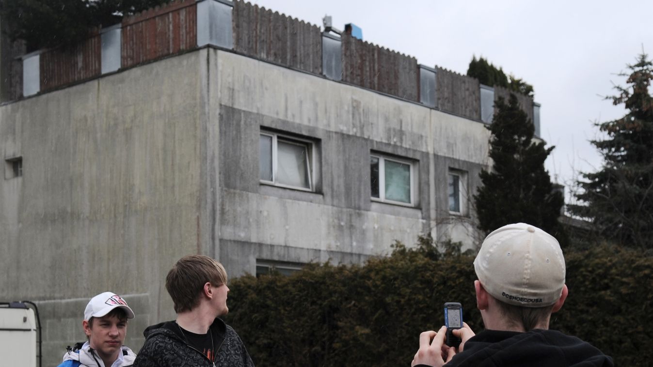HORIZONTAL A youth takes a photo on with his cellular telephone in front of the house of Josef Fritzl, an Austrian father who is charged with sequestering and raping his daughter in a cellar for 24 years, in Amstetten on March 16, 2009. Fritzl pleaded gui