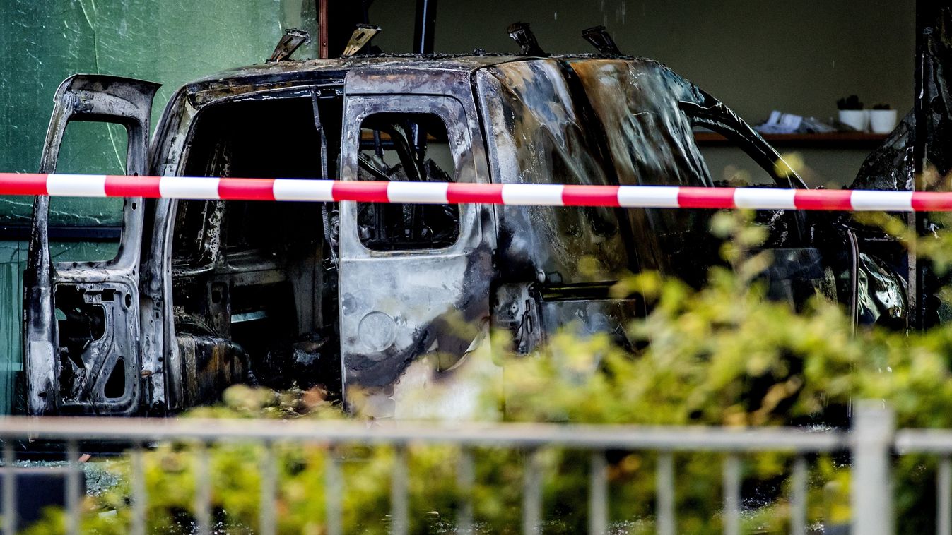 accident media Horizontal A picture taken on June 26, 2018 on Basisweg street in Amsterdam, shows a van that crashed through the front door of the building that houses newspaper De Telegraaf.  
The vehicle went up in flames, causing a large amount of dama