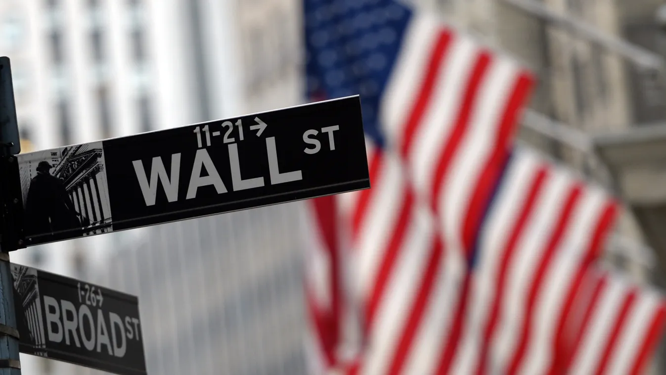 Horizontal FLAG WALL STREET (FILES) This file photo taken on January 7, 2016 shows the corner of Wall and Broad Street across from the New York Stock Exchange.
Wall Street stocks jumped to fresh records August 5, 2016 after the Labor Department reported t
