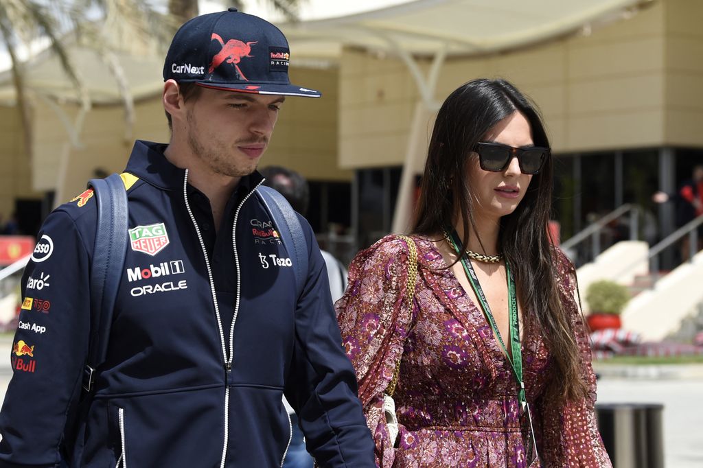 Red Bull's Dutch driver Max Verstappen arrives with his girlfriend Kelly Piquet (R) ahead of the third practice session ahead of the Bahrain Formula One Grand Prix at the Bahrain International Circuit in the city of Sakhir on March 19, 2022. (Photo by Maz