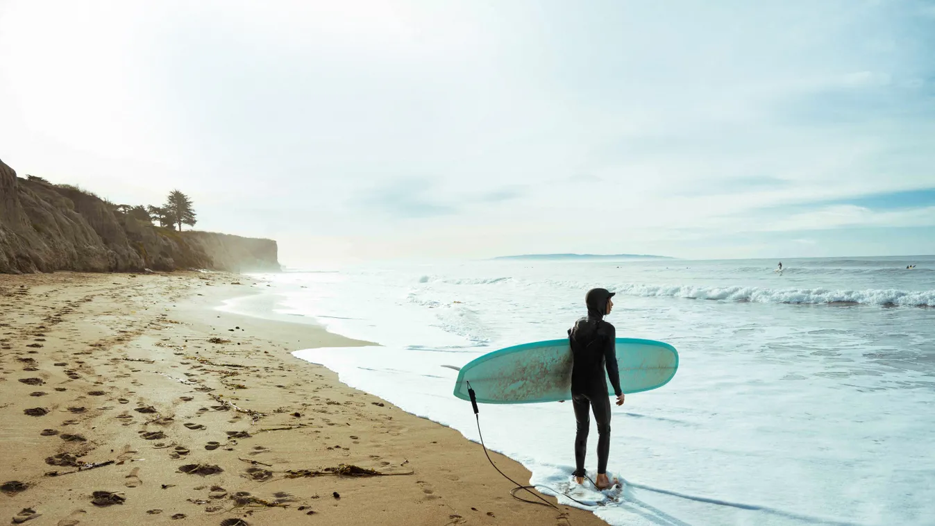 adrenaline adventure alive ambition aspiration balance beach coast landform outdoors out bold confidence carefree carrying in arms carrying challenge cloudy cloudscape cloud weather copy space day discovery diving suit sporty wet suit sportswear enjoyment