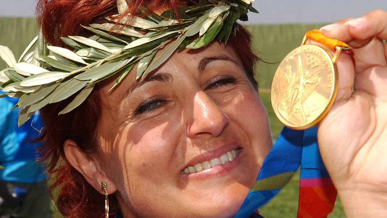 Athens 2004 - Shooting: Igaly wins gold GREECE:GRC SPO Sports Sports_Events athens_2004 medal_ceremony olympics showing_medal single skeet Horizontal SHOOTING CLOSE-UP GOLD MEDAL LAUREL CROWN OLYMPIC GAMES SMILING 