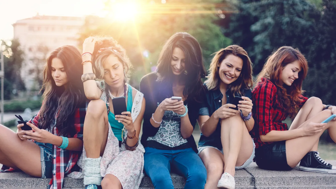 Group of girls texting on smartphones Smart Phone Beautiful Schoolgirl Five People Using Phone Adolescence Teenagers Only Student Text Messaging Girls Teenage Girls Women Females Group Of People Beauty In Nature Surfing the Net Global Communications E-Mai