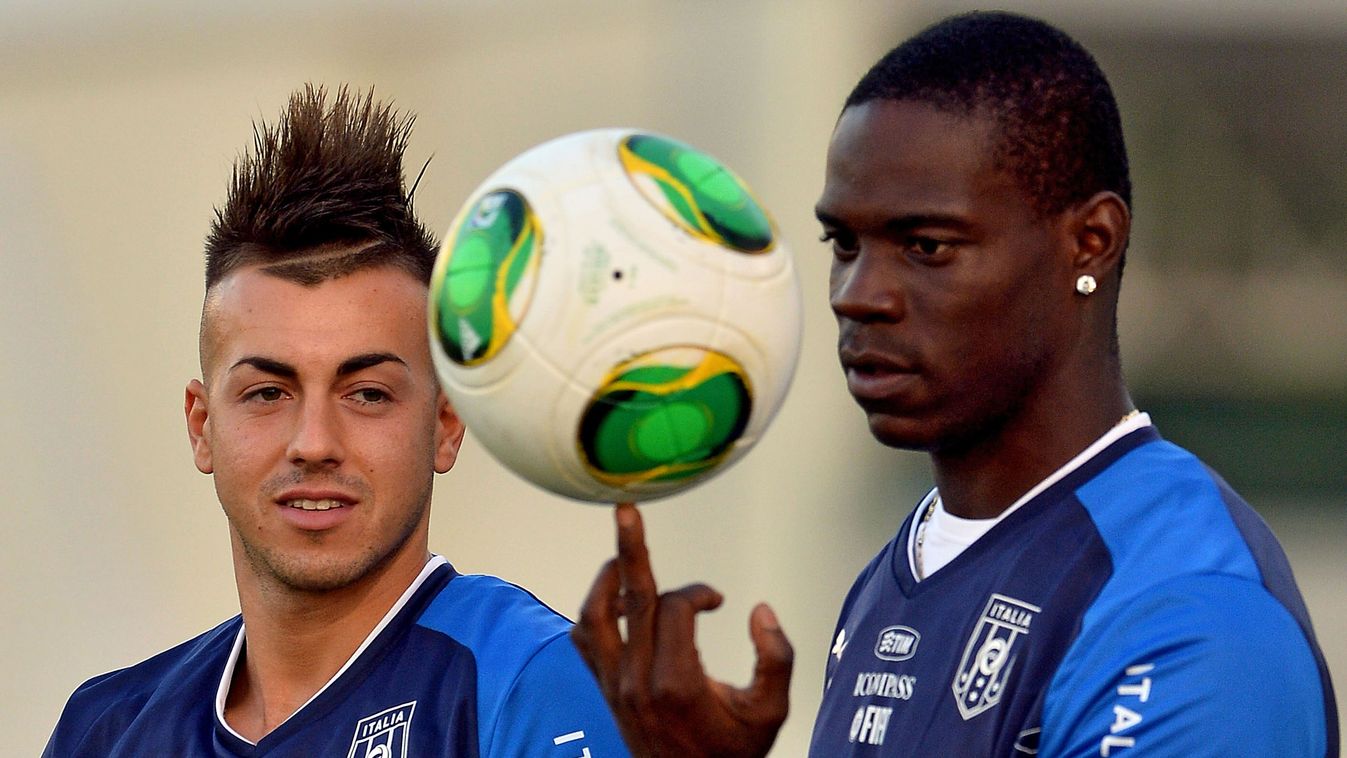 HORIZONTAL FOOTBALL TRAINING BUST Italy's forward Mario Barwuah Balotelli (R) plays with a ball next to teammate forward Stephan El Shaarawy during their first training at the Joao Havalange stadium in Rio de Janeiro on June 10, 2013, before their friendl
