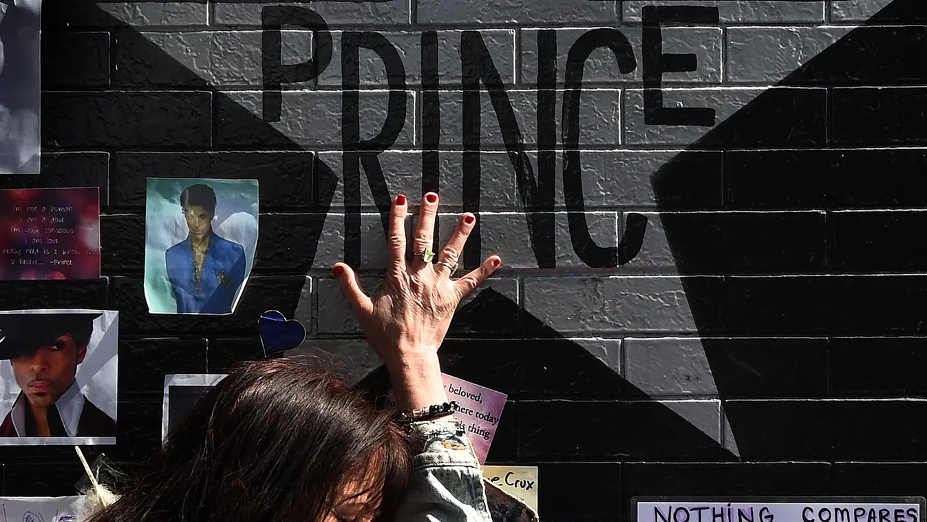 music Horizontal Prince fan Ann Sawatzky touches the star of music legend Prince who died suddenly at the age of 57, at the First Avenue club where he started his music career in Minneapolis, Minnesota, on April 23, 2016.
There was no evidence of trauma o