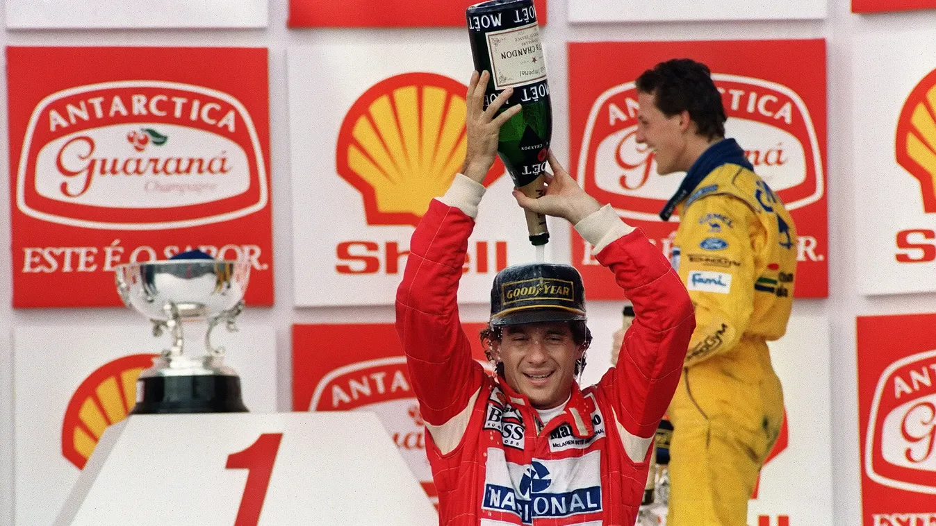 - HORIZONTAL F1 RACING DRIVER CAR JOY CHAMPAGNE PODIUM TROPHY VICTORY GRAND PRIX (FILES) - A file picture taken on March 28, 1993 shows Brazilian Formula One driver Ayrton Senna pouring Champagne over himself celebrating his victory in the Brazilian Grand