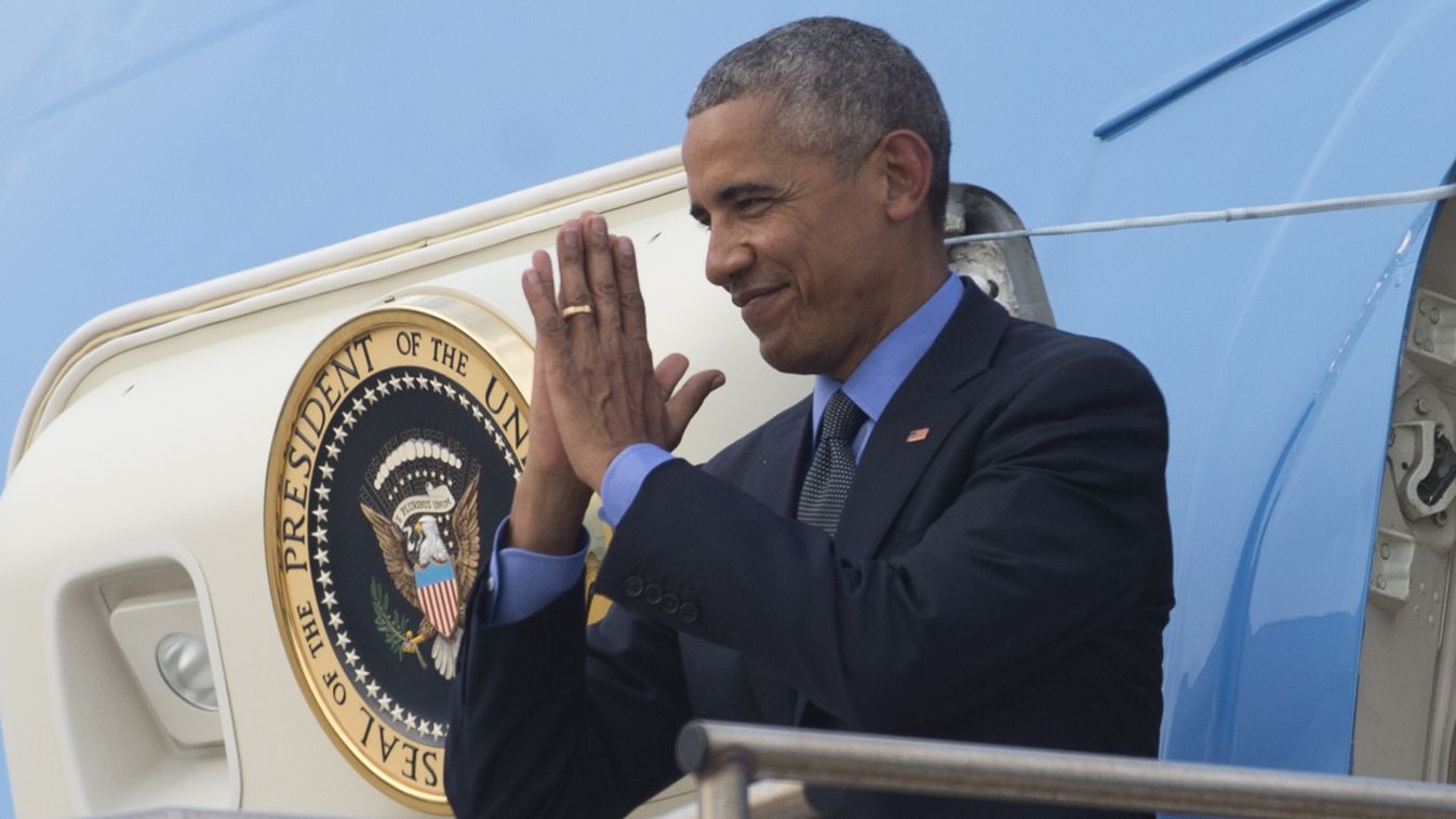 summit diplomacy Horizontal US President Barack Obama gestures as he boards Air Force One prior to departure from Wattay International Airport in Vientiane on September 8, 2016, following his visit to Laos and attending the Association of Southeast Asian 