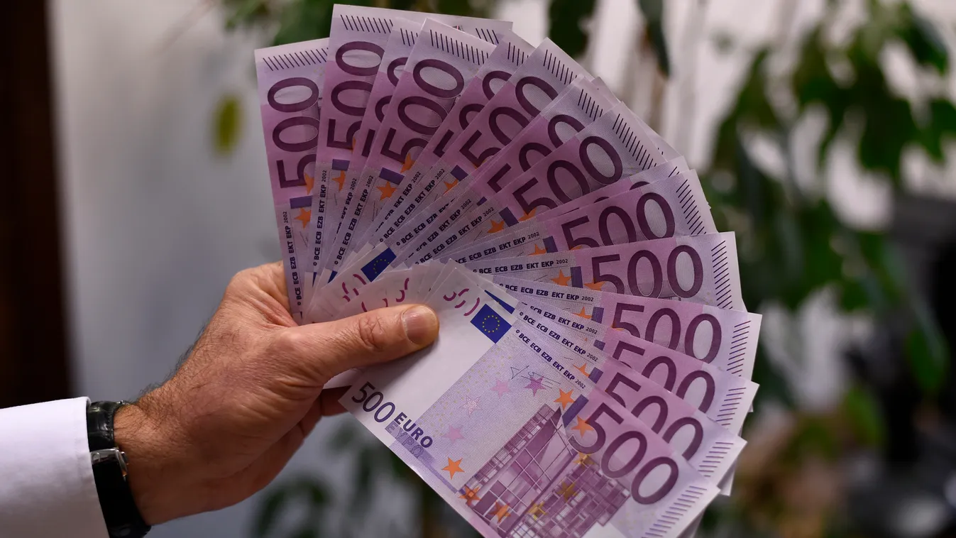 Horizontal A person presents several 500 Euro notes on February 12, 2016 in Paris. 
The European Central Bank will take a decision soon on whether to keep printing 500-euro banknotes, with the arguments for doing so becoming "less and less convincing", a 