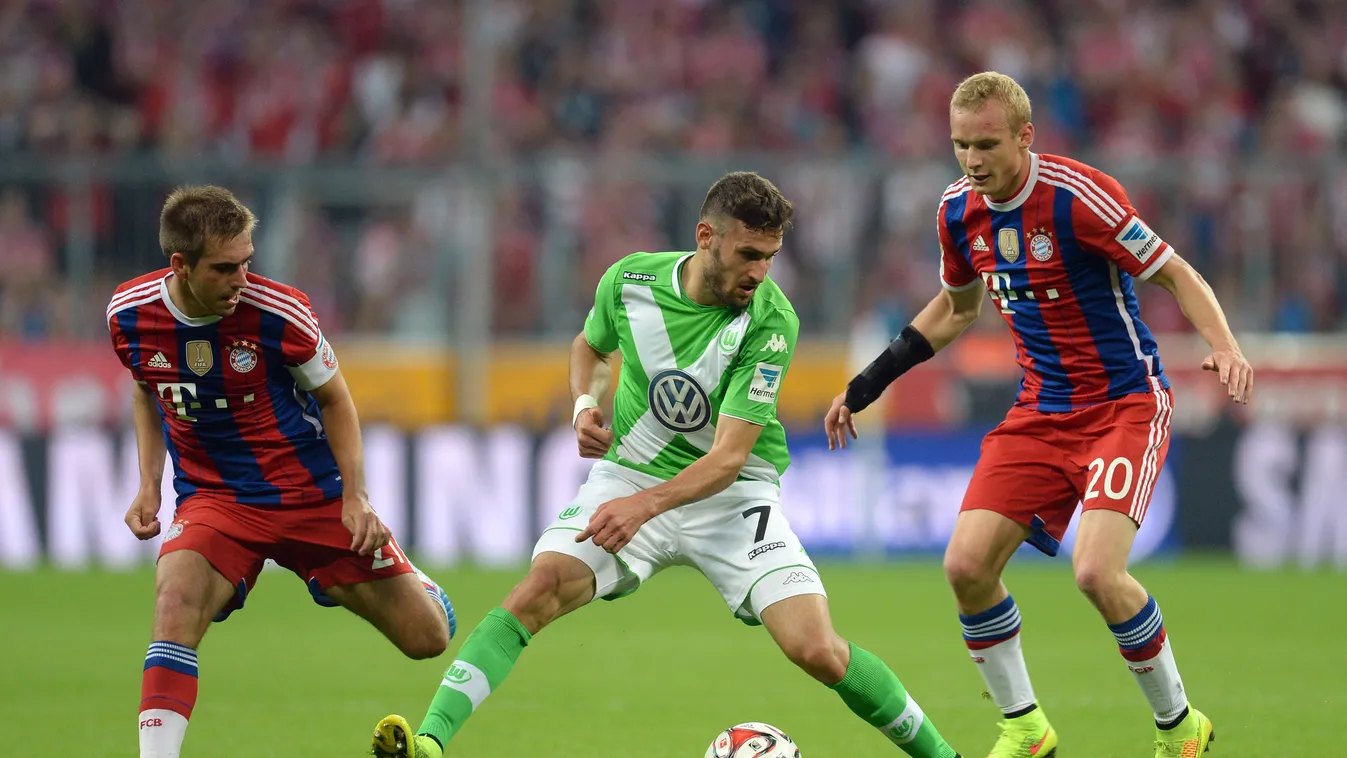 504671199 Bayern Munich's defender Philipp Lahm (L) and midfielder Sebastian Rode (R) vie with Wolfsburg's defender Daniel Caligiuri (C) for the ball during the German first division Bundesliga football match FC Bayern Munich vs VfL Wolfsburg at the Allia