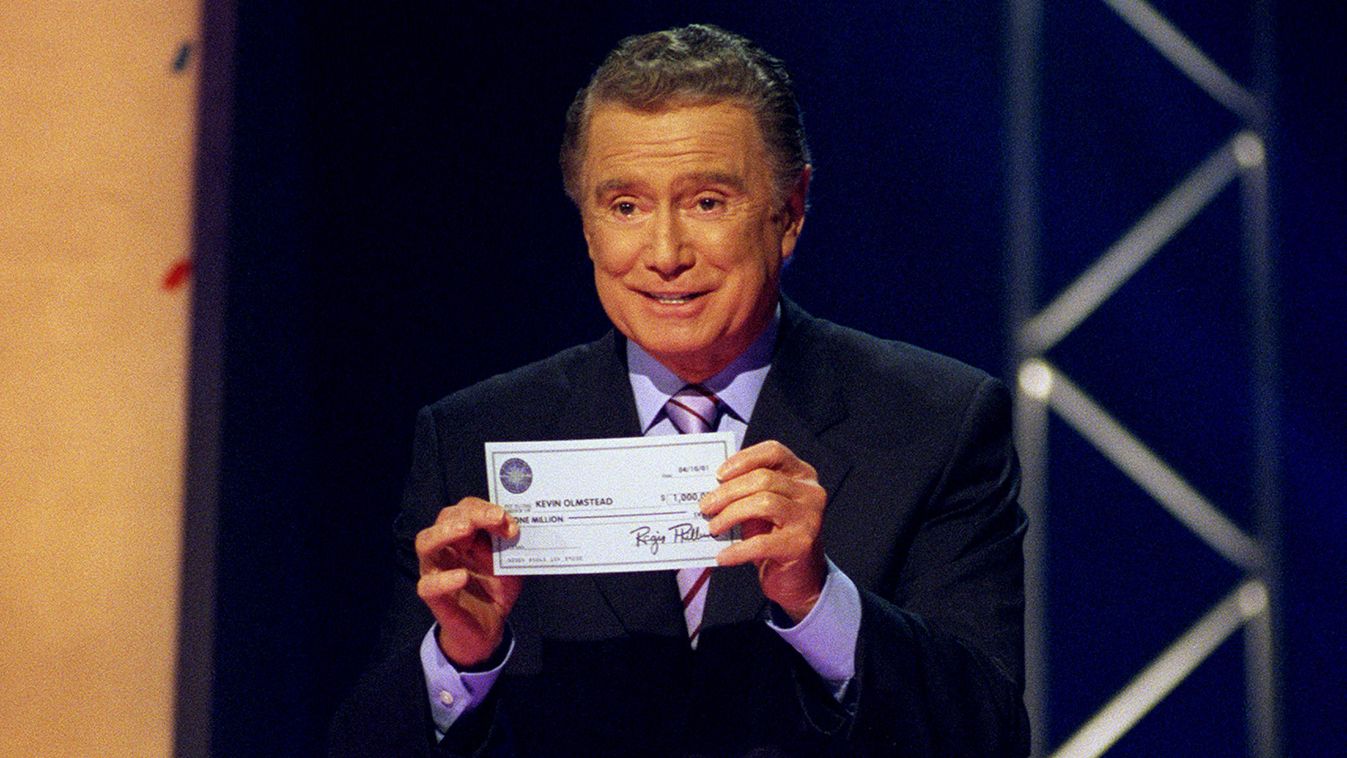WHO WANTS TO BE A MILLIONAIRE UNITED STATES - MARCH 21:  WHO WANTS TO BE A MILLIONAIRE? - 4/10/01, Host Regis Philbin presented a $2,180,000 check to the latest millionaire winner Kevin Olmstead on the ABC Television Network's popular show, WHO WANTS TO B