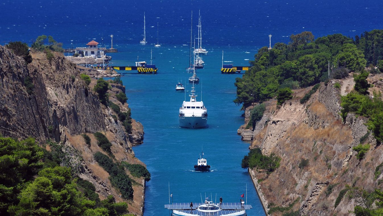 The world's largest solar-powered boat, "MS Turanor PlanetSolar" sails through the Corinth Canal near the town of Corinth on July 28, 2014.  The boat arrived to Greece as part of a joint archaeological project focused on underwater exploration off one of 