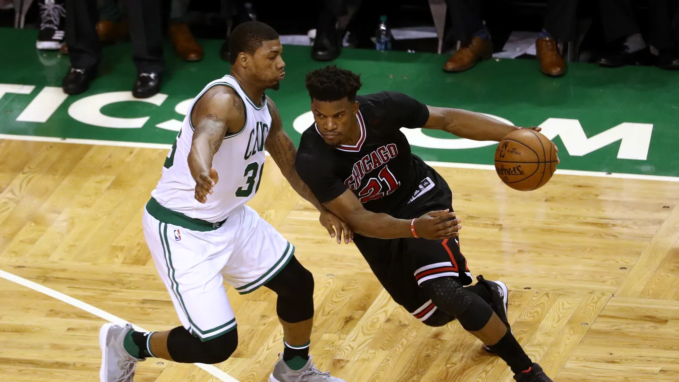 BOSTON, MA - APRIL 16: Jimmy Butler #21 of the Chicago Bulls drives against Marcus Smart #36 of the Boston Celtics during the third quarter of Game One of the Eastern Conference Quarterfinals at TD Garden on April 16, 2017 in Boston, Massachusetts. NOTE T