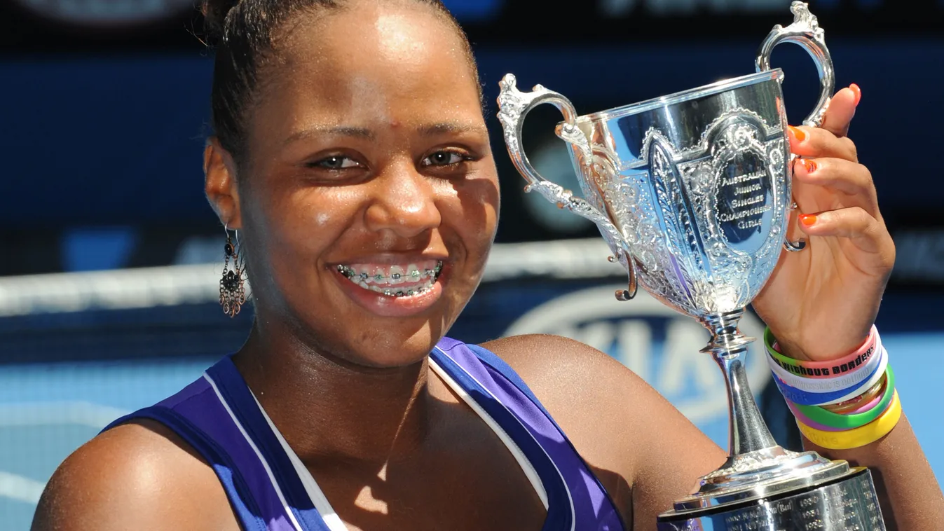 VERTICAL Taylor Townsend of the US poses with the trophy after victory in her girls singles final match against Yulia Putintseva of Russia on the thirteenth day of the Australian Open tennis tournament in Melbourne on January 28, 2012.  Townsend won 6-1. 