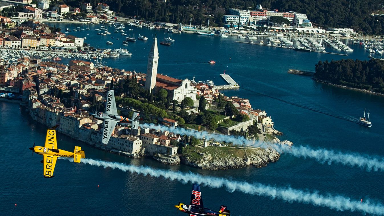 Nigel Lamb (GBR), Hannes Arch (AUT), Peter Besenyei (HUN) - Action Nigel Lamb of Great Britain, Hannes Arch of Austria and Peter Besenyei of Hungary fly in front of the city of Rovinj prior to the second stage of the Red Bull Air Race World Championship i
