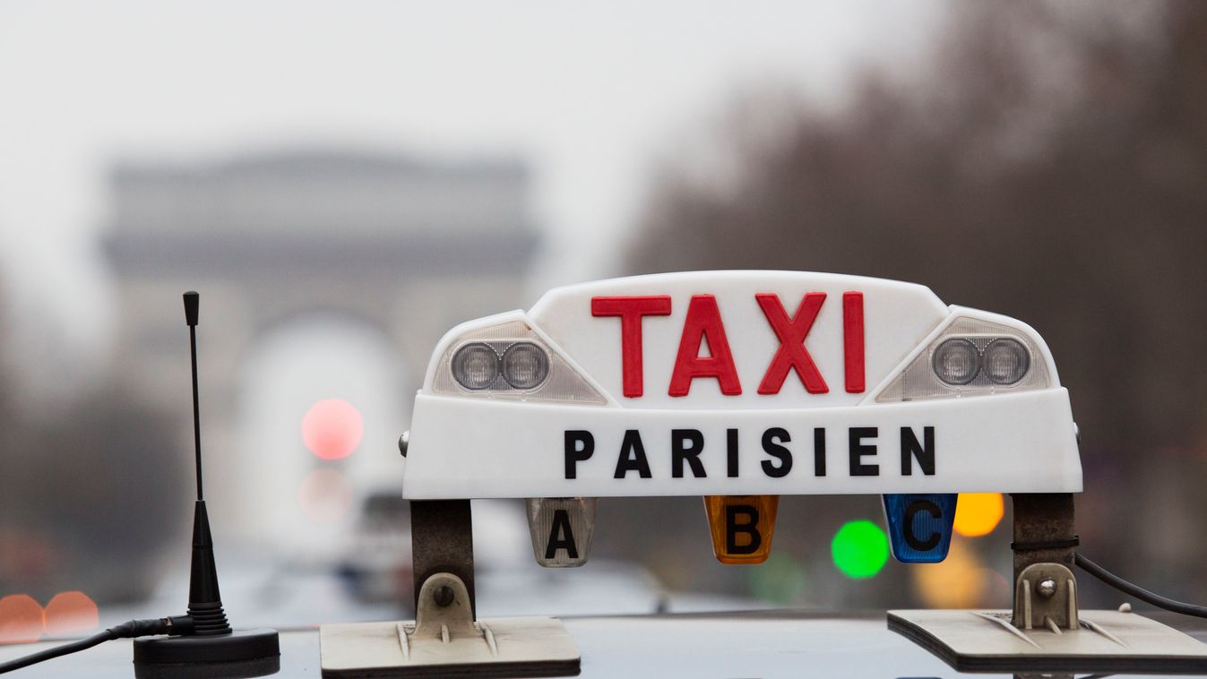 Taxi drivers protest against Uber in France France protest Uber TAXI Paris protestor ARC DE TRIOMPHE French taxi drivers Uber app SQUARE FORMAT 