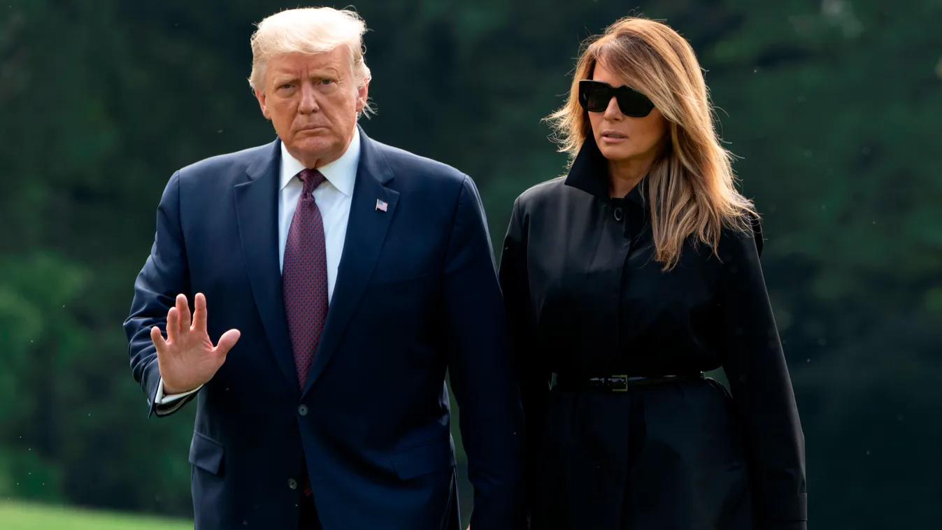 politics Horizontal SIDE BY SIDE HAND IN HAND (FILES) In this file photo taken on September 11, 2020 US President Donald Trump and First Lady Melania Trump return to the White House in Washington, DC. - US President Donald Trump said on October 1, 2020 ev