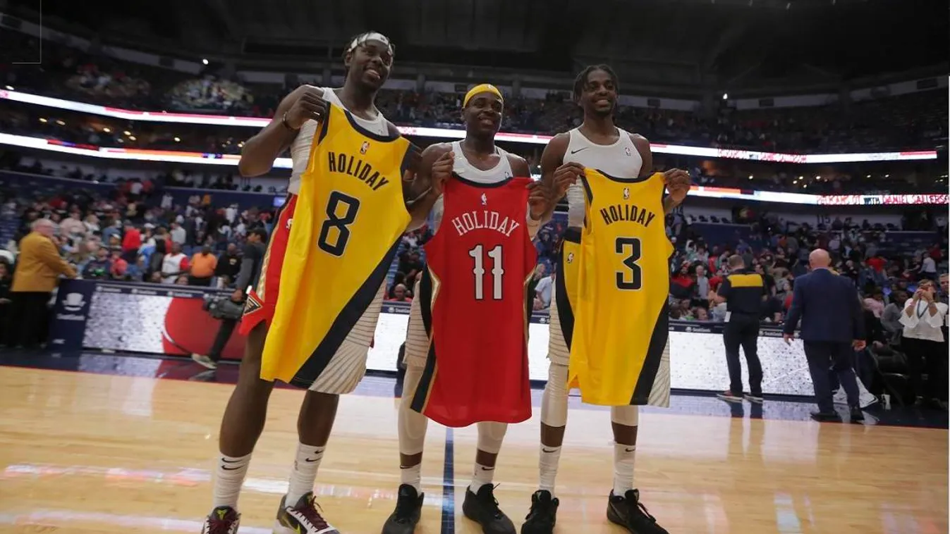 NBA: Indiana Pacers at New Orleans Pelicans NPSTrans toppic Dec 28, 2019; New Orleans, Louisiana, USA;  Brothers New Orleans Pelicans guard Jrue Holiday (left) and Indiana Pacers guard Aaron Holiday (center) and forward Justin Holiday (left) hold up their