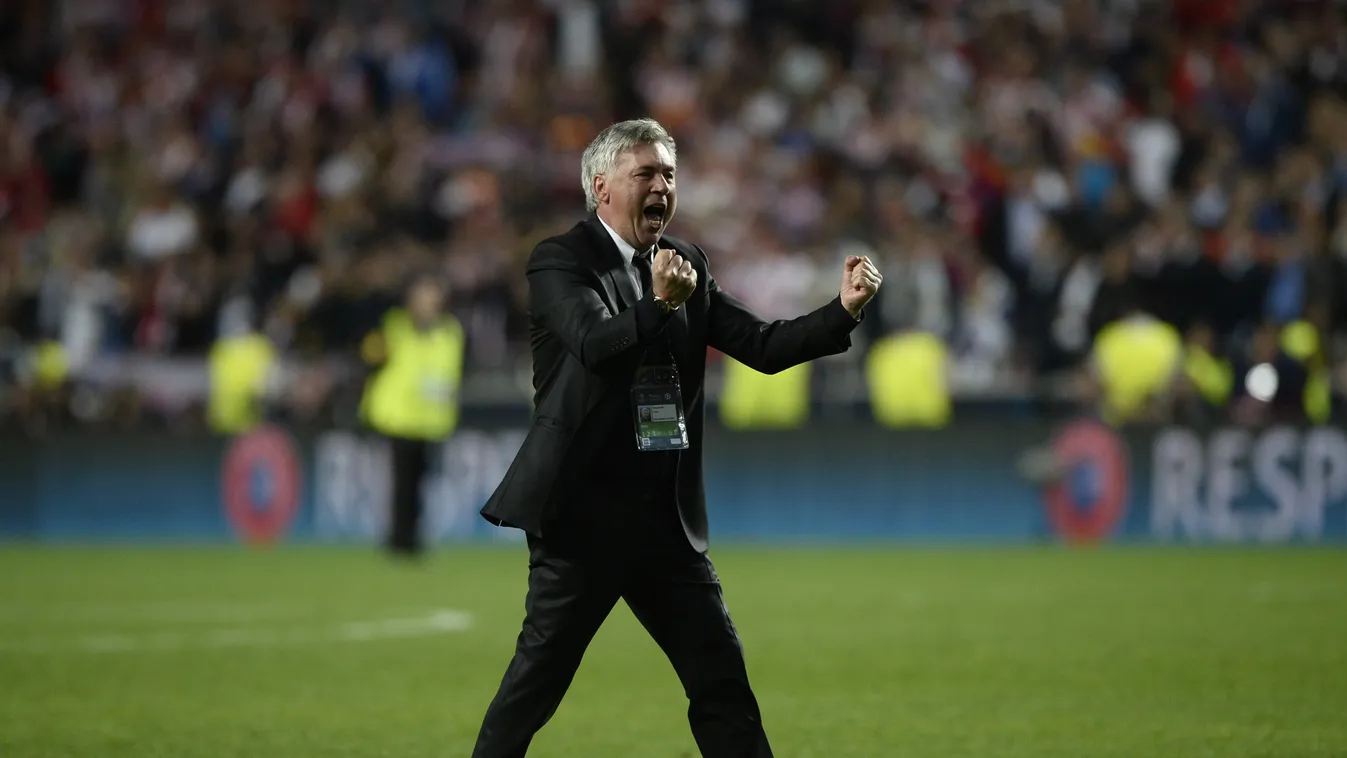 491655011 Real Madrid's Italian coach Carlo Ancelotti celebrates after winning the UEFA Champions League final between Atletico Madrid and Real Madrid on May 24, 2014 at the Luz stadium in Lisbon.        AFP PHOTO / FRANCK FIFE 