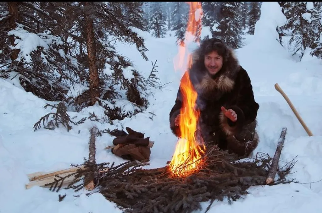 Life Below Zero: Series 02: Episode 09: Breaking Point Picture Shows: Glenn cuts trees for firewood; makes a friction fire at camp. 