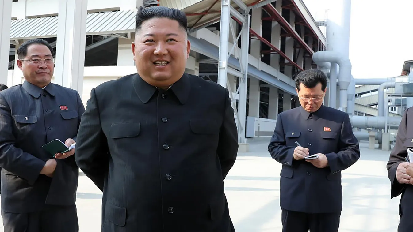 TOPSHOTS Horizontal SMILING This picture taken on May 1, 2020 and released from North Korea's official Korean Central News Agency (KCNA) on May 2, 2020 shows North Korean leader Kim Jong Un (2nd L) visiting the completed Suchon phosphate fertilizer factor