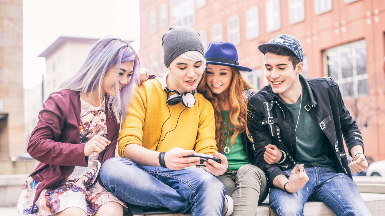 Teenagers meeting outdoors Smart Phone Beautiful Computer Adolescence Teenagers Only Social Gathering Leisure Activity Girls Teenage Girls Women Boys Men Group Of People Youth Culture Handheld Video Game Remote Control Young Adult Teenager Sitting Watchin