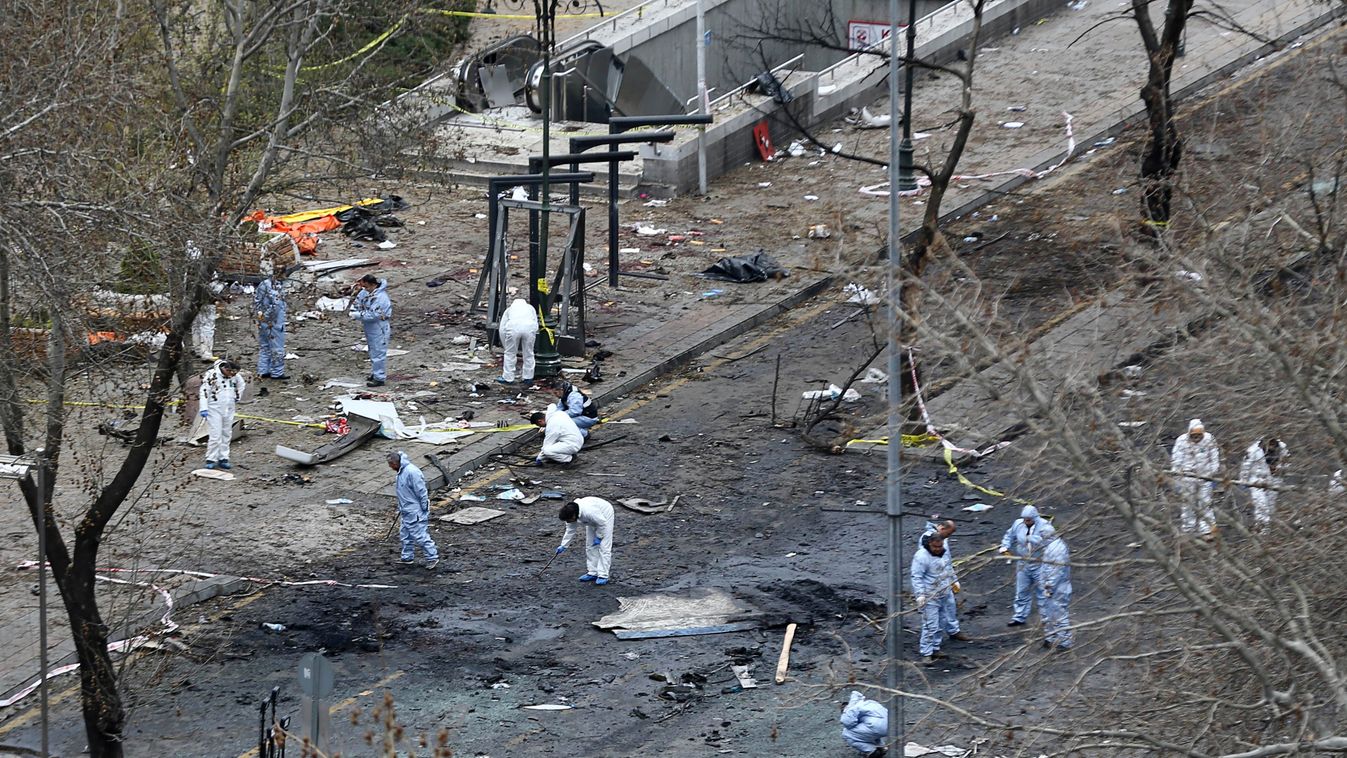 TOPSHOTS Horizontal TERRORIST ATTACK SUICIDE BOMBING SCENE OF THE ATTACK FIRE CAR BOMB CAR SQUARE FORENSIC MEDICINE KURD Forensic experts investigate the scene of an explosion on March 14, 2016 the day after a suicide car bomb ripped through a busy square