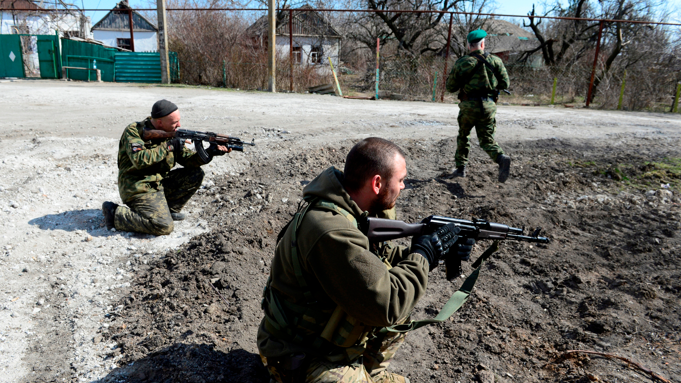 Soldiers of the self-proclaimed Donetsk People's Republic (DNR) take position in the frontline town of Shyrokyne, some 10 kms east of Mariupol, on March 20, 2015. The town, held by both DNR and Ukrainian troops, is a constant flashpoint with weekly casual