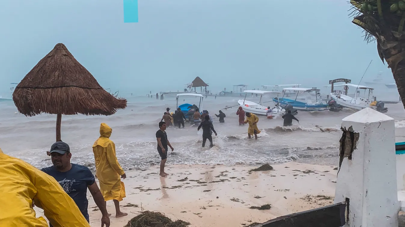 weather Horizontal Fishermen try to protect their boats from heavy rains due to the passage of Storm Gamma in Puerto Morelos, Quintanaroo State, Mexico, on October 03, 2020. - Tropical Storm Gamma is located on Mexico's Yucatan Peninsula (southeast), wher