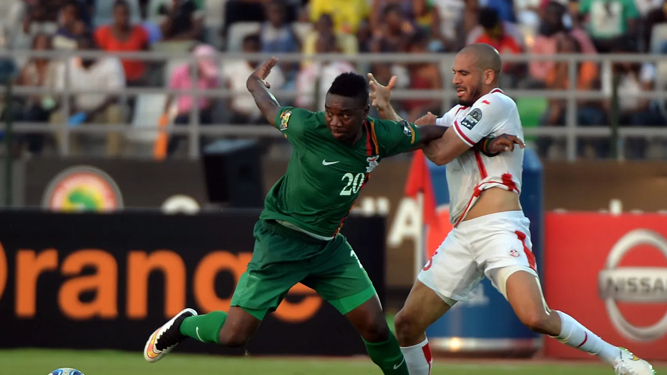 528433303 Tunisia's defender Aymen Abdennour (R) vies with Zambia's forward Emmanuel Mayuka during the 2015 African Cup of Nations group B football match between Zambia and Tunisia in Ebebiyin on January 22, 2015. AFP PHOTO / KHALED DESOUKI 