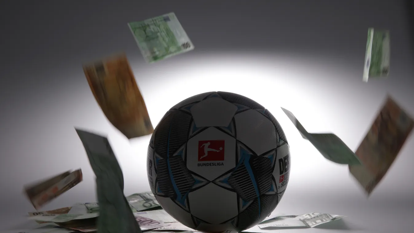 firo: 06.05.2020 Football: Fuvuball: 1 + 2 Bundesliga. DFL. German Fuvuball League game ball of the season 2020/2021 Derbystar banknotes, euros, notes around the game ball Money rules the world and the Fuvuball The professional clubs of the 1st and 2nd le