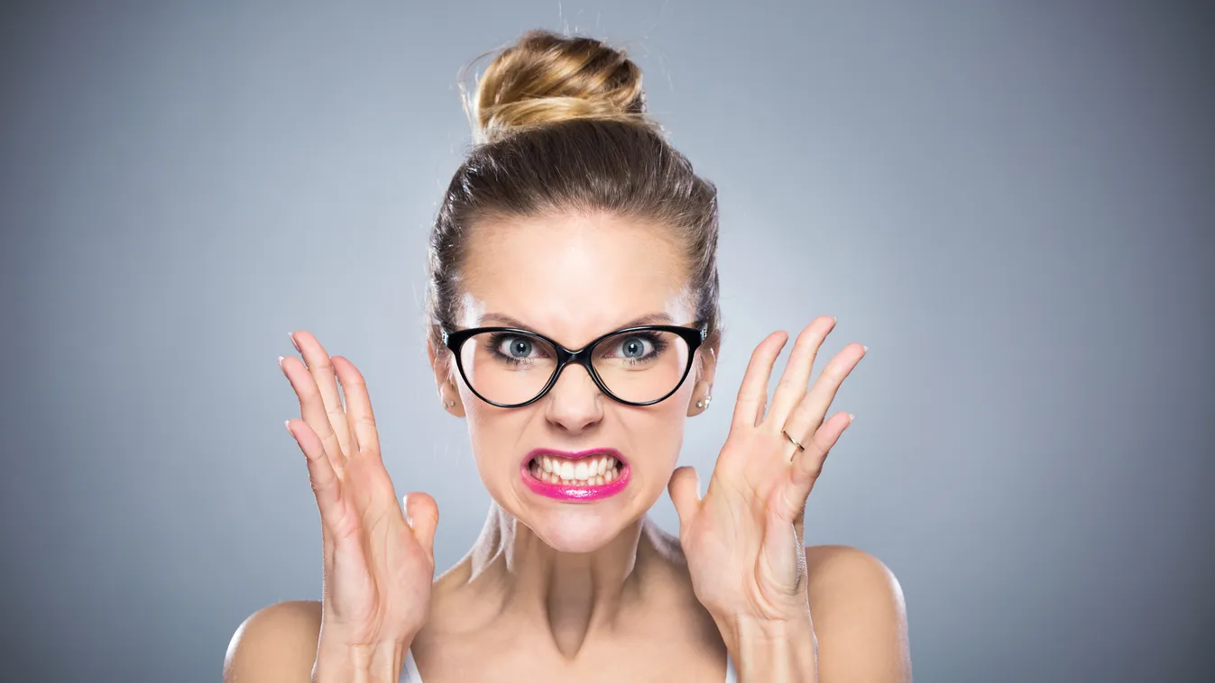 Angry young woman Beautiful Women Clenching Teeth Facial Expression Furious Gesturing Looking Irritation Caucasian Ethnicity One Person Physical Pressure Frustration Emotional Stress Anger Studio Shot Displeased Negative Emotion Emotion Human Teeth Human 