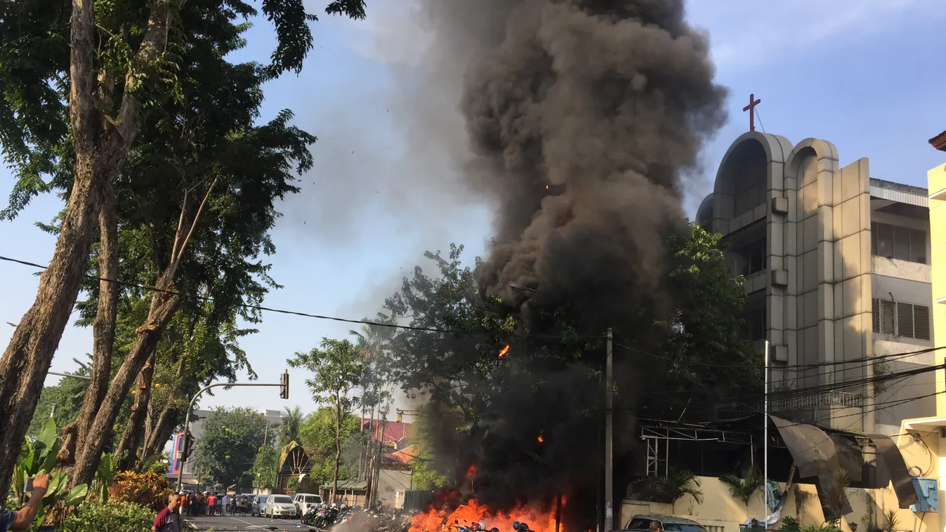 TOPSHOTS Horizontal TERRORIST ACTION SCENE OF THE ATTACK SMOKE POLICE OFFICER FIRES AND FIRE-FIGHTING FLAME CHURCH GENERAL VIEW 