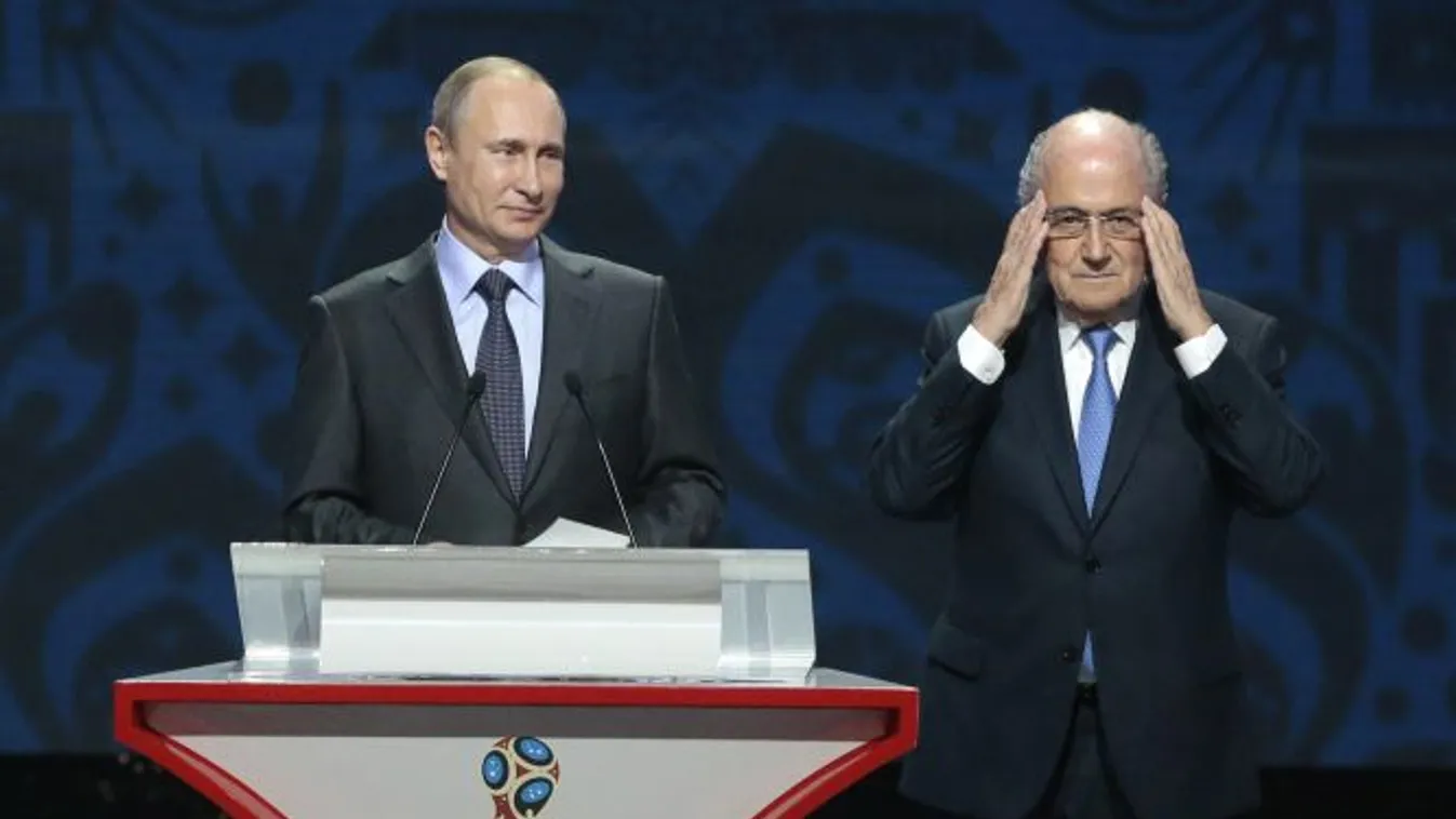 FIFA President Sepp Blatter, right, adjusts his glasses during a speech by Russian President Vladimir Putin during the preliminary draw for the 2018 soccer World Cup in Konstantin Palace in St. Petersburg, Russia, Saturday, July 25, 2015. (AP Photo/Ivan S