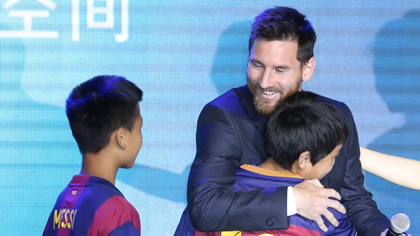 Lionel Messi suits up to meet press for Messi Experience Park in Beijing China Chinese Beijing Lionel Messi Argentinian striker soccer football 