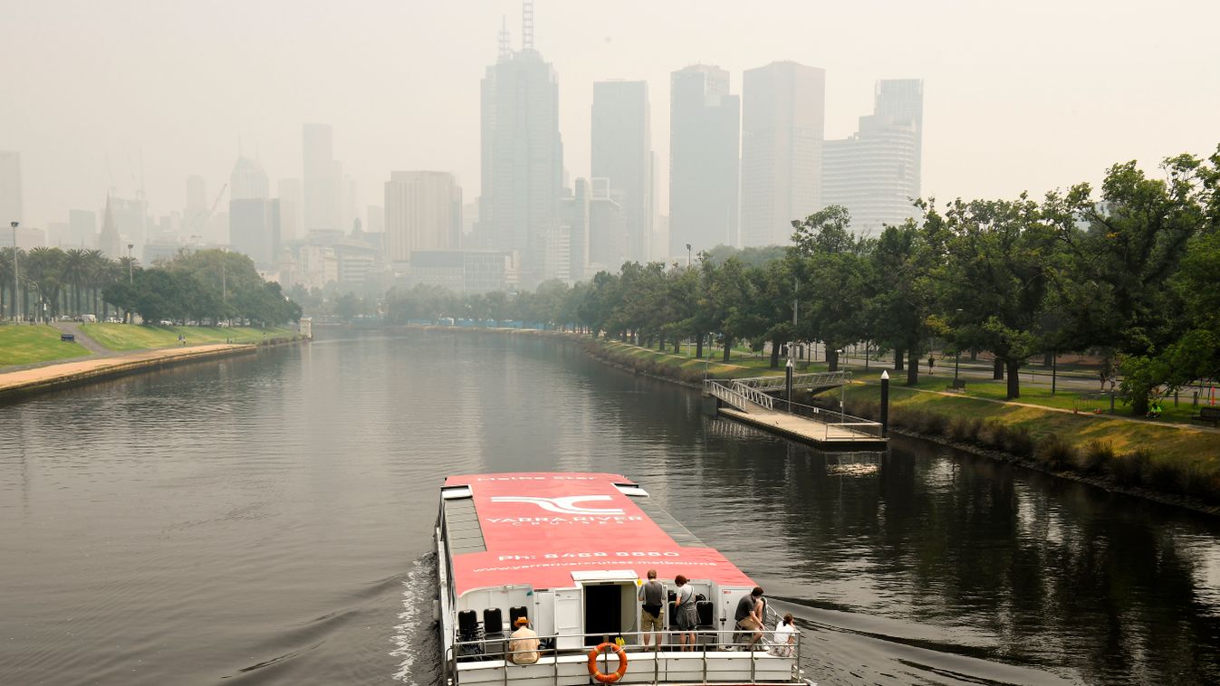 fire climate Horizontal Smoke haze from unprecendented bushfires hover over the city skyline ahead of the Australian Open in Melbourne on January 14, 2020. - Soaring pollution halted Australian Open practice and delayed qualifying on January 14 as smoke f